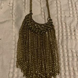 Gold tone tassel necklace.